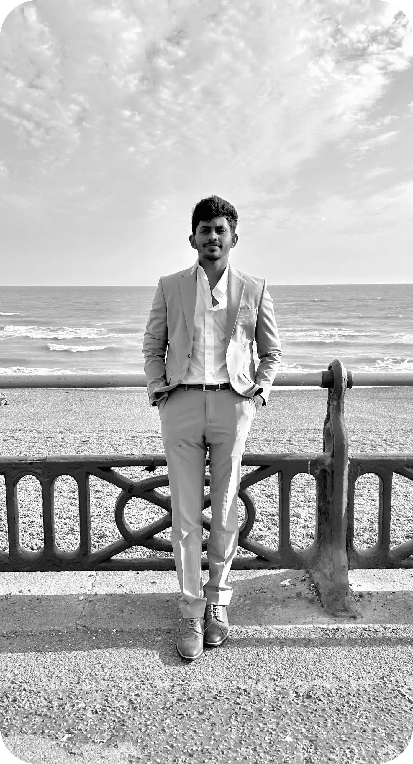 Srinivas standing by the sea